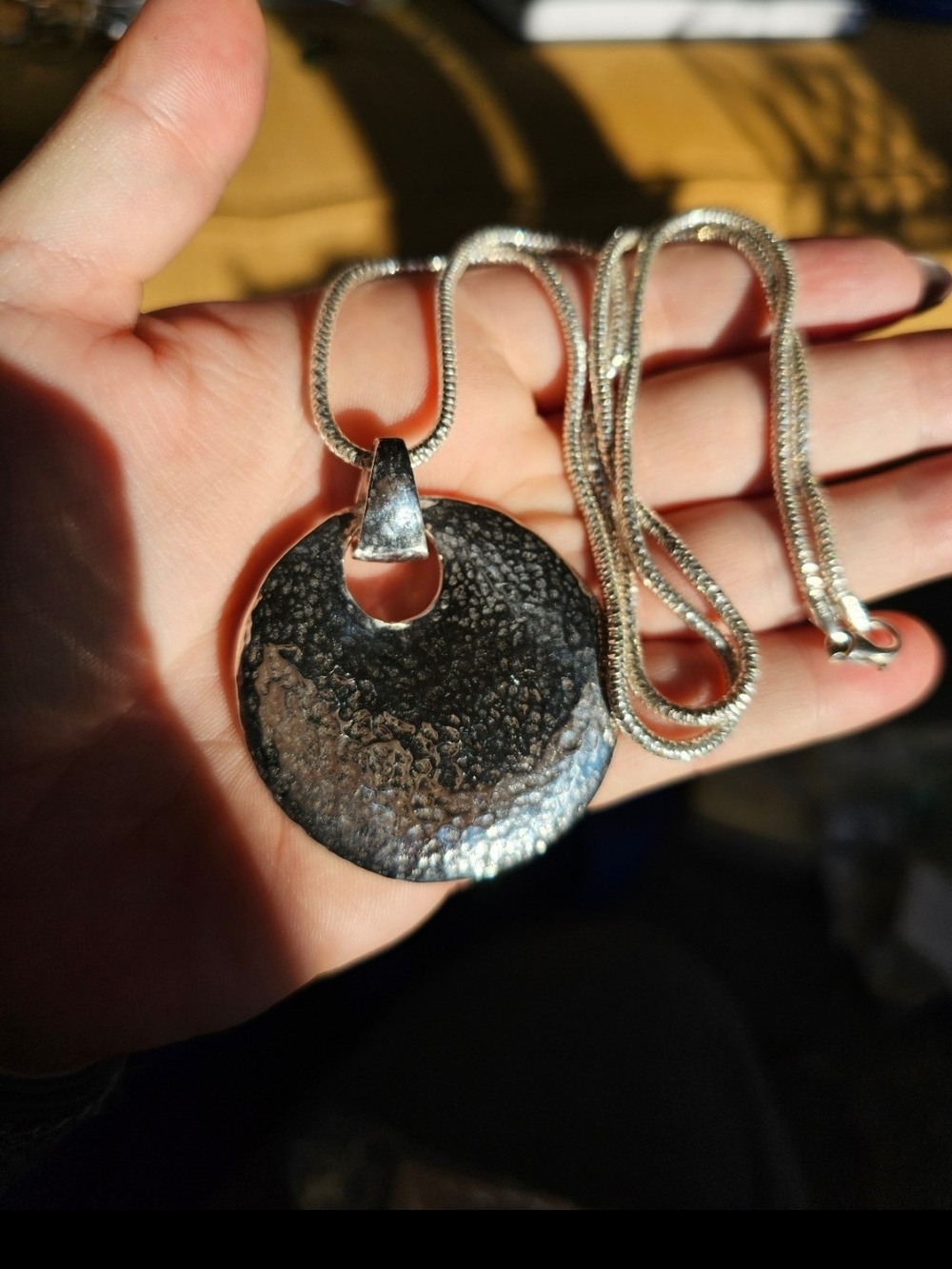 Sterling silver pendant and chain. Approximately 33 grams. Stamped 925 Milor Ita